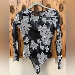 French Kiss black Mesh Bodysuit with white embroidered flowers. Beautiful.